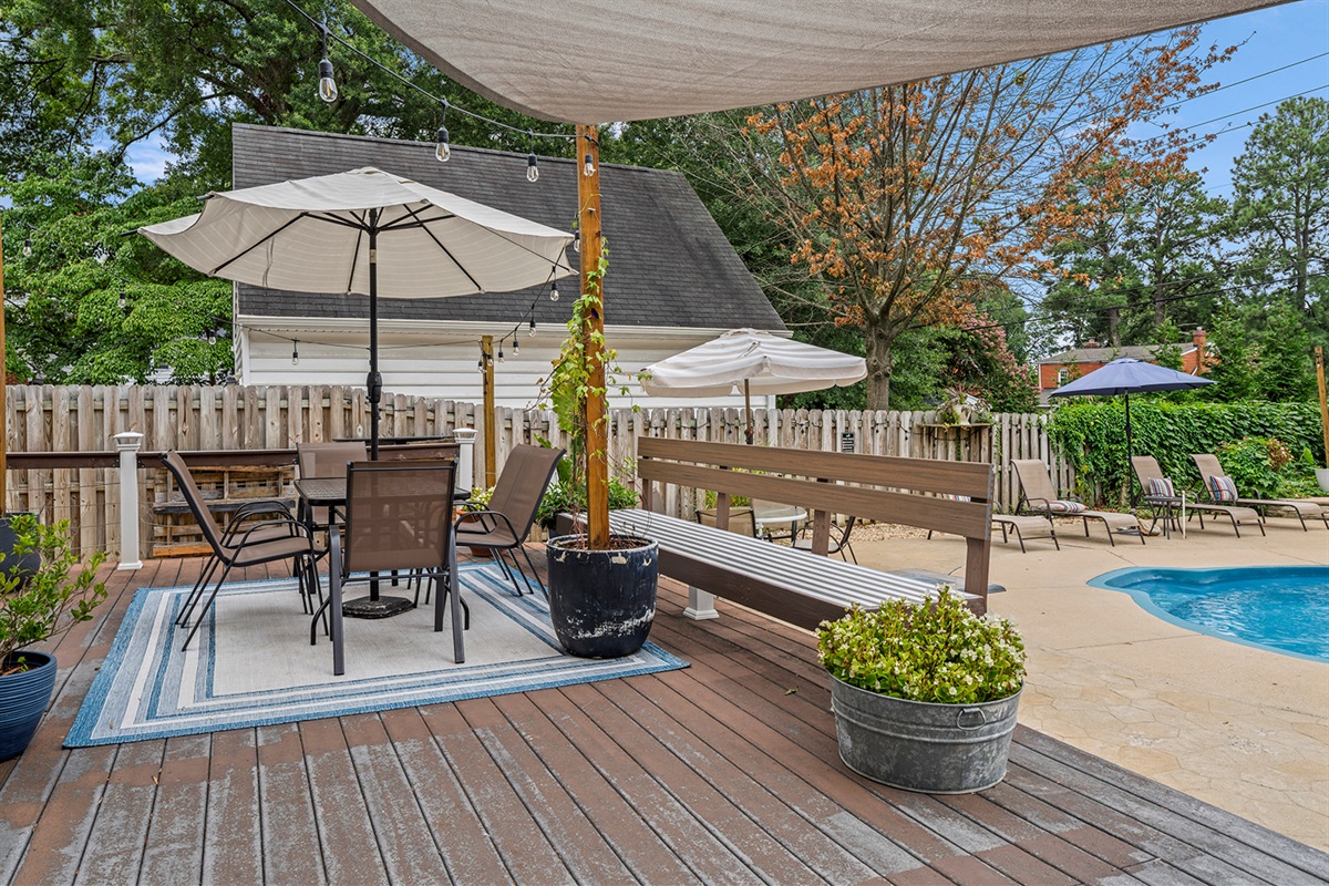 Outdoor Paradise: Dine al fresco under the sun with stunning views of the pool and landscaped yard!