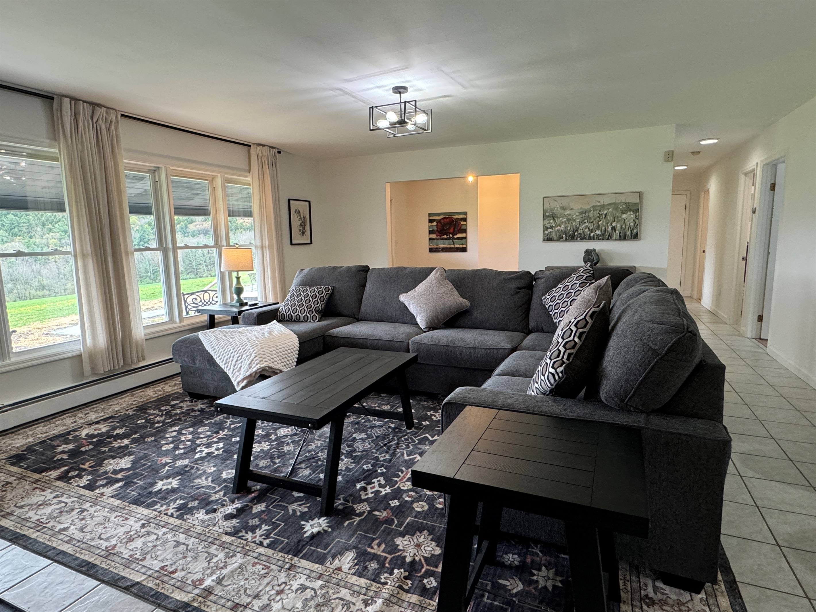 Comfy living room with views of fields and lake