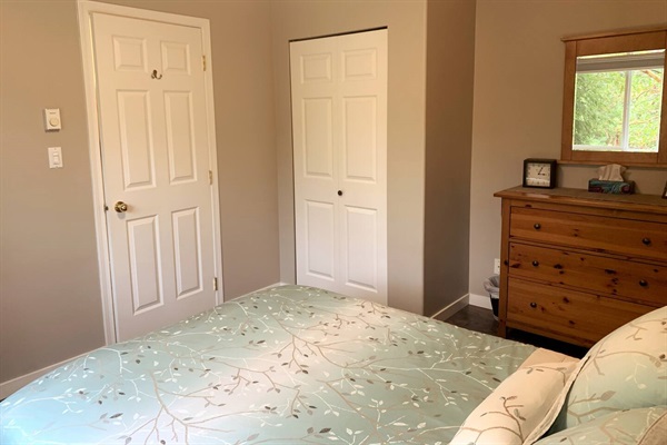 Bedroom has a large dresser as well as a closet to store your clothes and luggage during your stay.