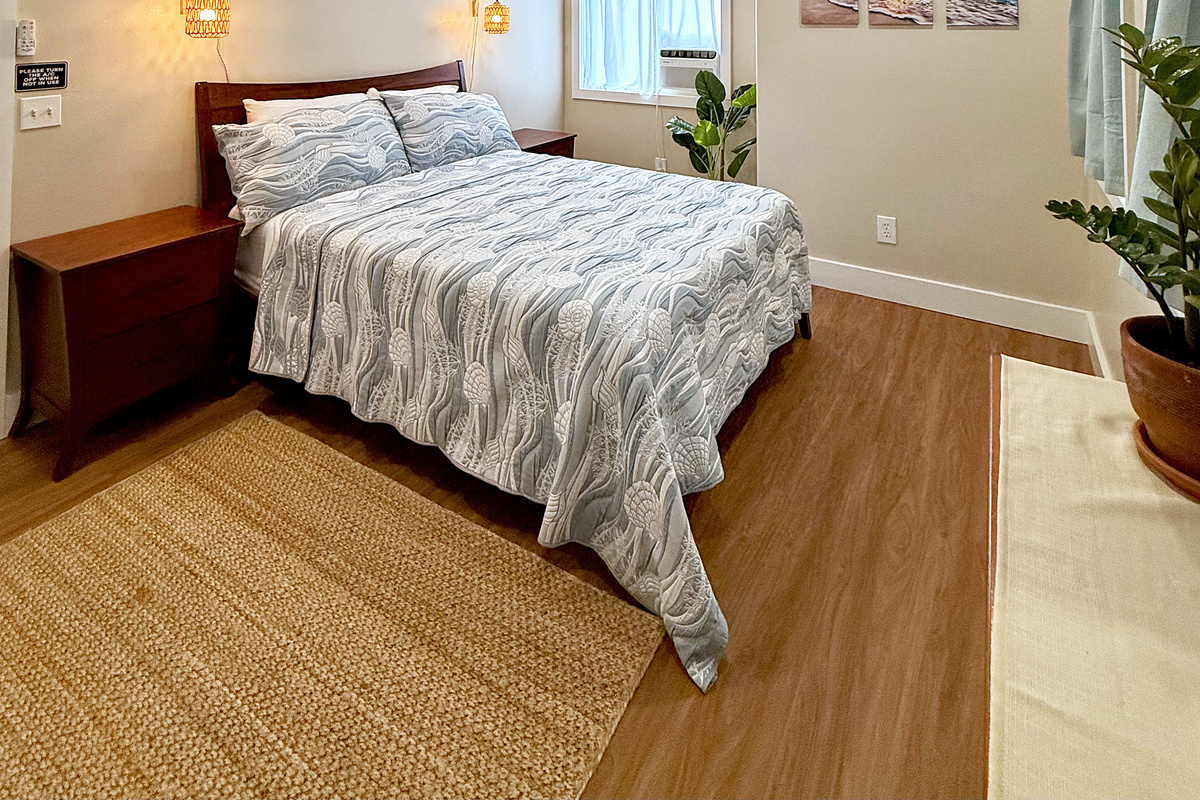 Queen Bedroom 1 | Representative Interior. Finishes, decor, and furniture, vary by duplex unit.