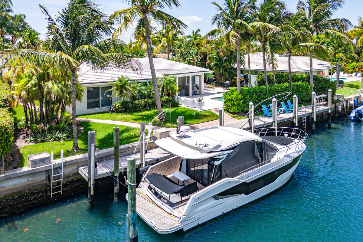 The boat shown is privately owned and not available for guest use. A separate portion of the dock is available for approved guest boats, subject to size restrictions and an additional fee.