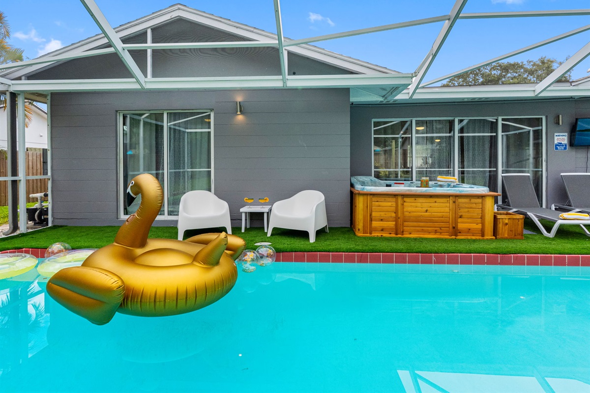 With its golden swan float, lush backdrop, and stylish layout, this pool deck is perfect for your next social-worthy moment.