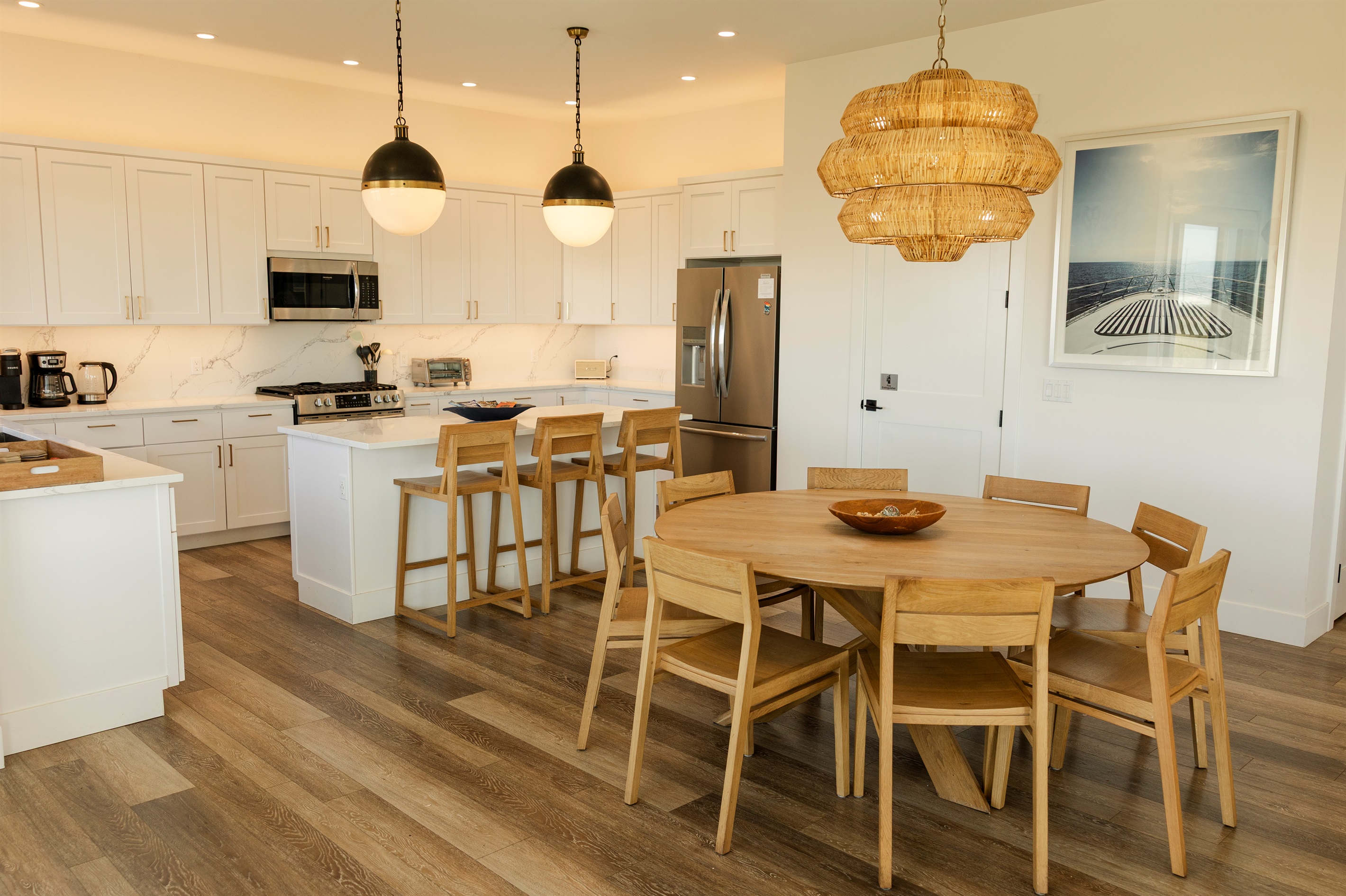 {Kitchen Details} Fully stocked chef’s kitchen featuring a prep island, range, dishwasher, fridge, and microwave — thoughtfully equipped to make cooking effortless.