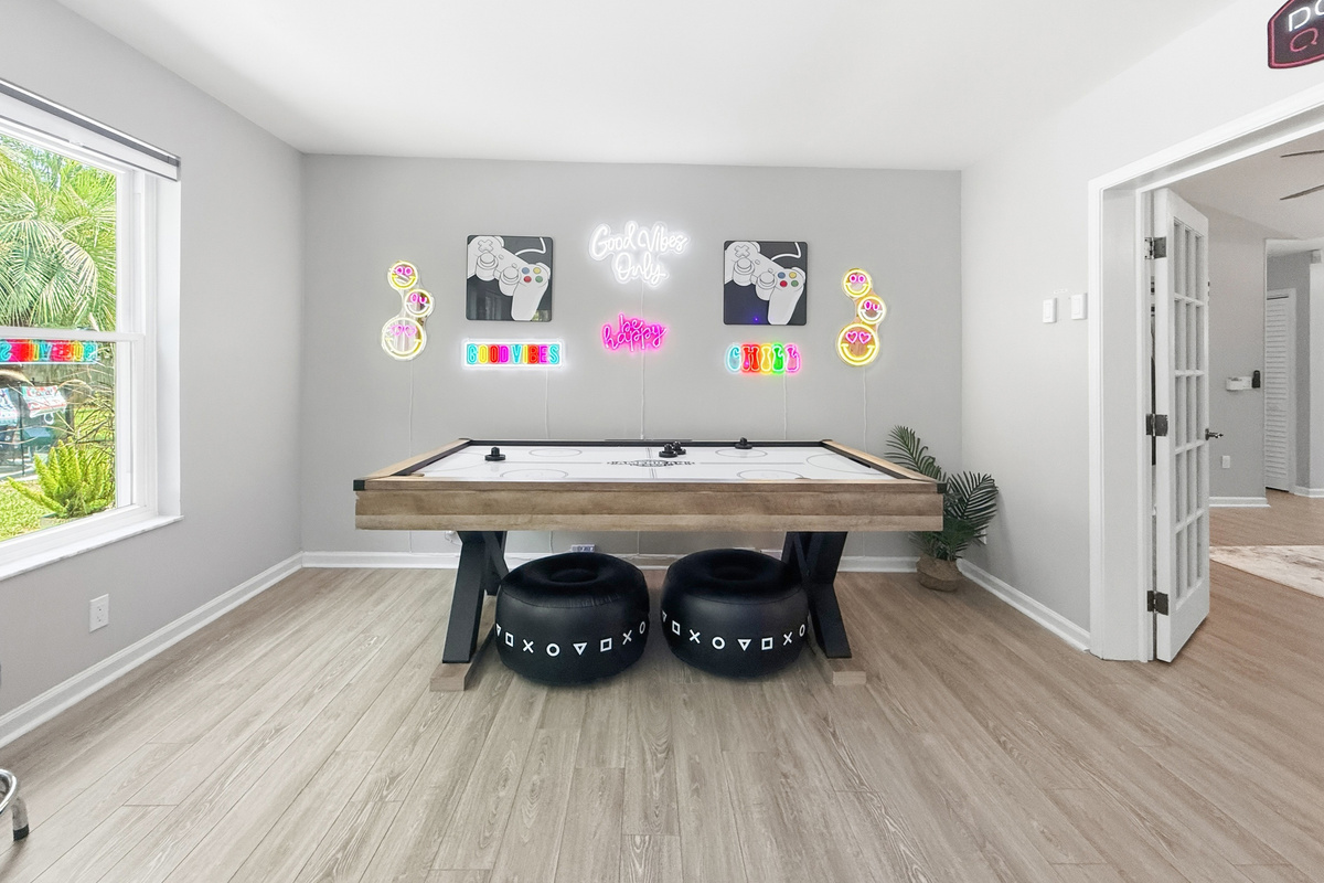The spacious game room gives everyone plenty of room to play, relax, and spend time together.