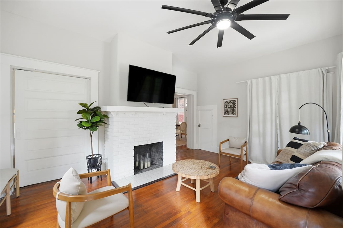 Living room with plenty of seating and 50" TV