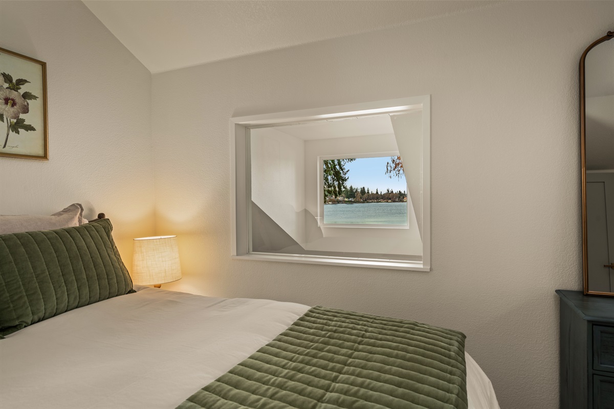 Second bedroom with views of lake, queen bed, premium linens, natural noise machine, own heat and a/c unit!