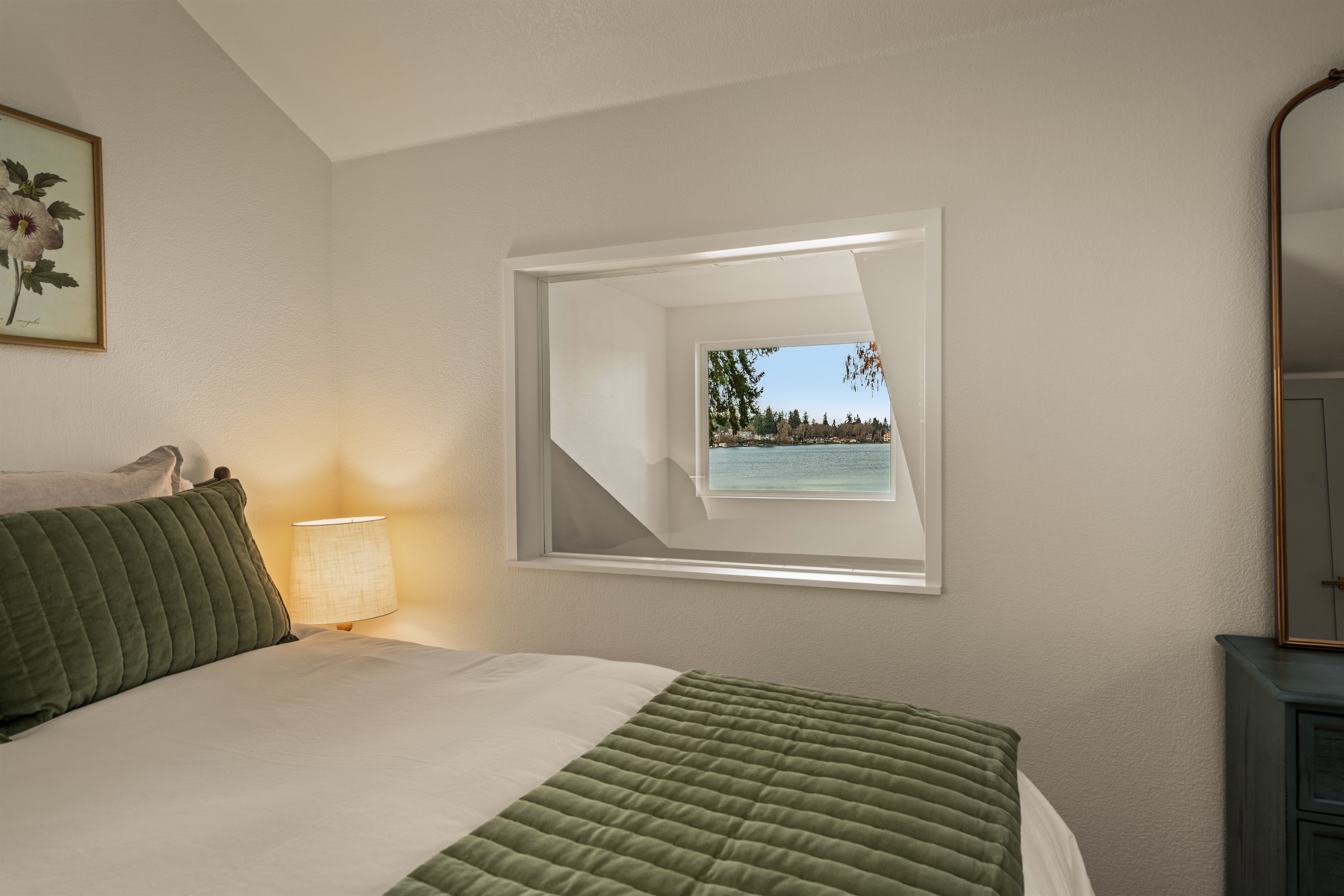 Second bedroom with views of lake, queen bed, premium linens, natural noise machine, own heat and a/c unit!