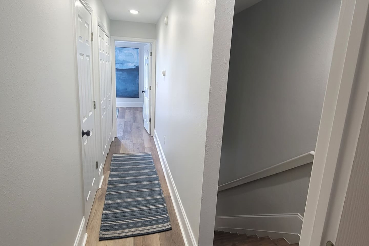 Step into easy flow between bedrooms &mdash; the hallway keeps both suites feeling private.