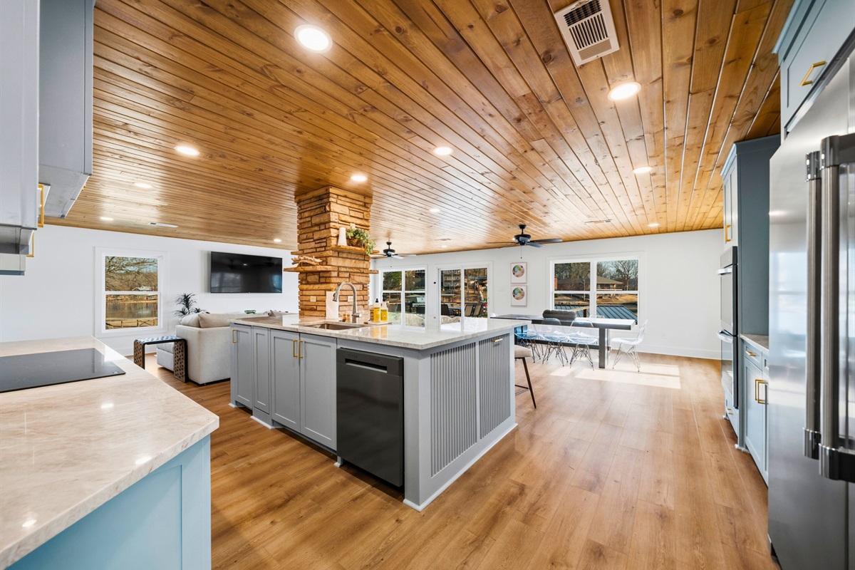 The kitchen and living spaces connect seamlessly, creating a bright and welcoming gathering area with plenty of room to spread out.