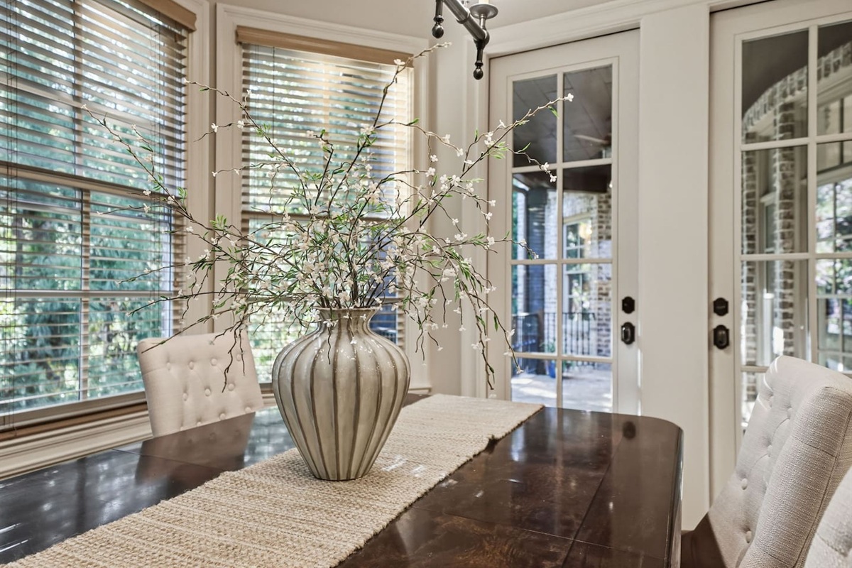 Cozy breakfast nook just off the kitchen, seating four comfortably. A warm, intimate space perfect for casual meals, morning coffee, or relaxed conversations.