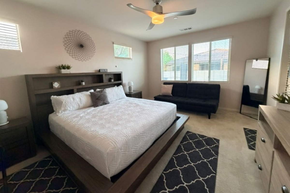 A king-size bed with a full futon