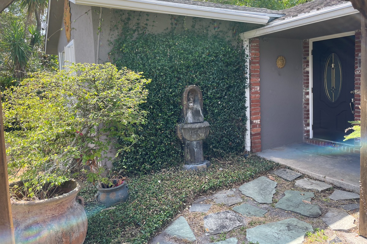 Enjoy time outside under the pergola, surrounded by a garden and fountains.