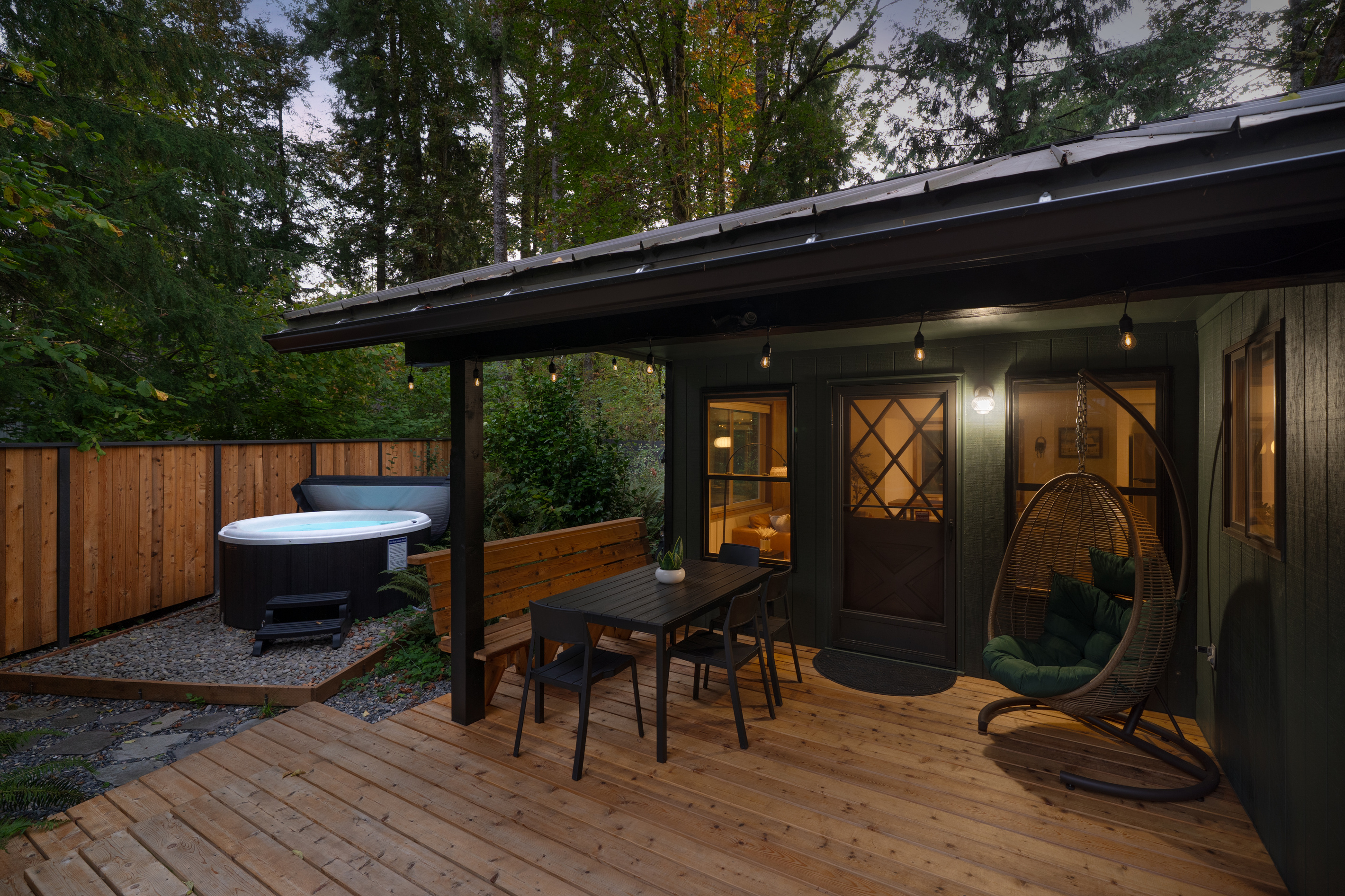 Hot tub, hanging chair, dinner table — your evening just got a lot more inviting.