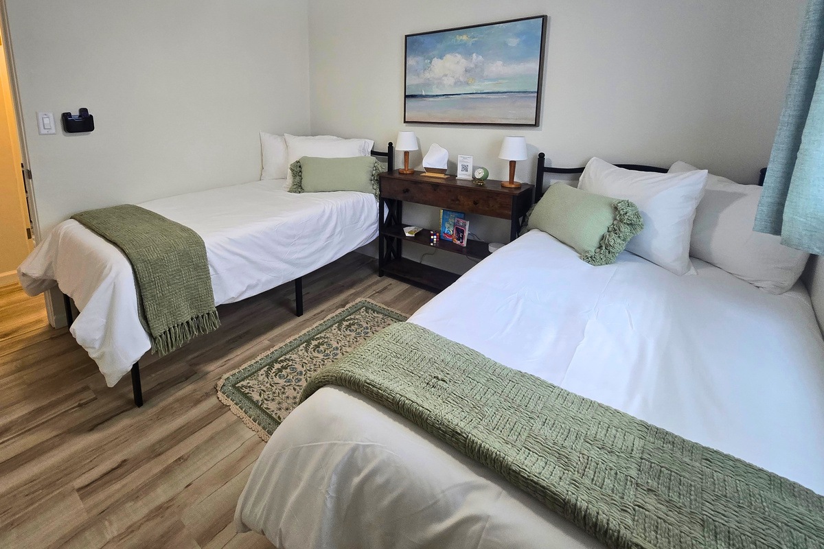 Serene Twin XL bedroom with calming sage accents and room to recharge.