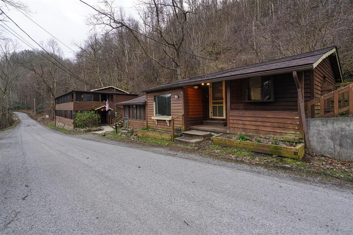 This door leads to unit 1. The larger unit youll be renting. Just toward the other building on the left is the entrance to unit 2.