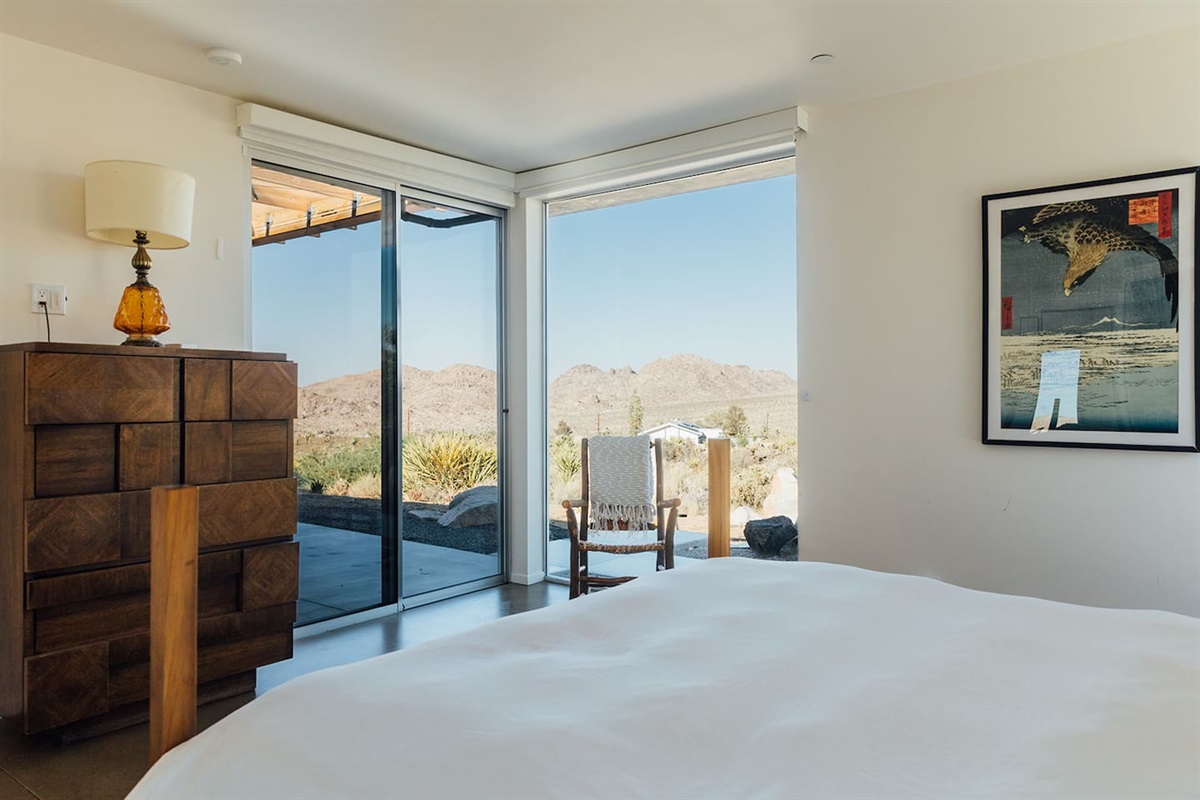 Wake up to mountain views and step outside through sliding doors that connect the bedroom directly to the patio.