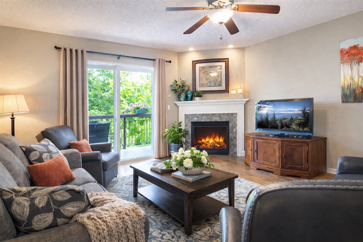 Bright and spacious living room with cozy fireplace — perfect for relaxing after exploring Pigeon Forge and the Great Smoky Mountains.