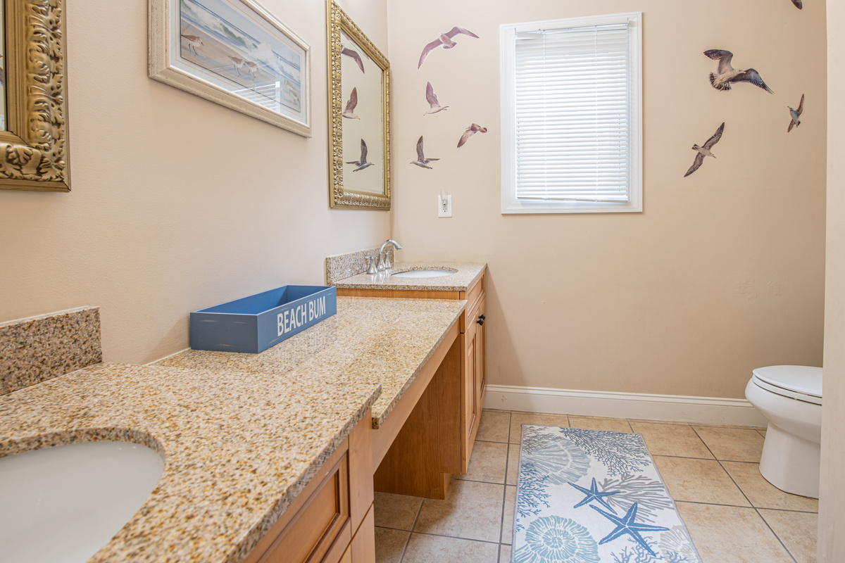 Bathroom 1 Vanity View Showing Granite Countertops and Toilet
