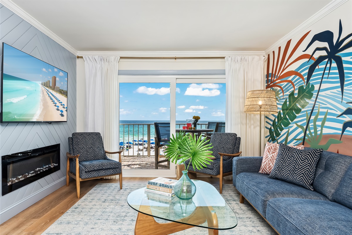 A bright, open living room where you can stretch out and enjoy floor-to-ceiling Gulf views.