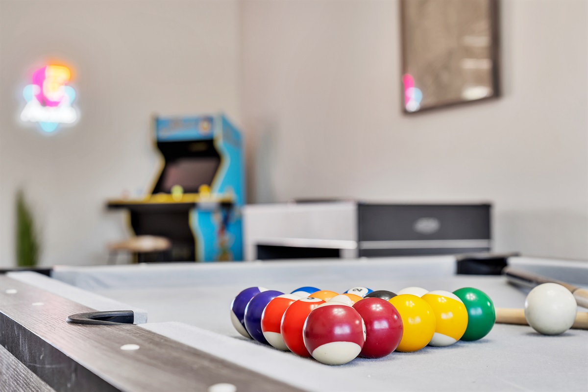 Dining room with large dining table that converts to pool table and ping pong table