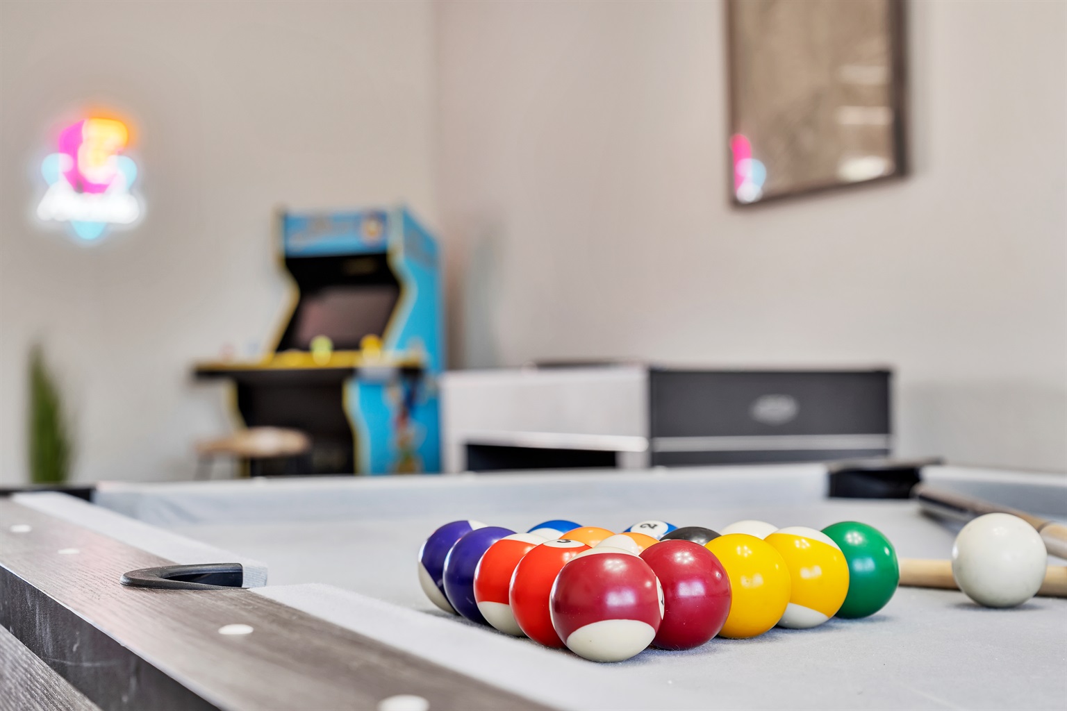 Dining room with large dining table that converts to pool table and ping pong table