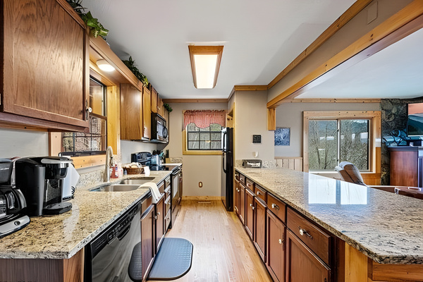 Everything you need to feel at home. The kitchen comes fully equipped with a dual coffee maker (drip and Keurig), expansive granite countertops, and plenty of cabinet space. Perfect for preparing full meals or packing snacks for a day out.