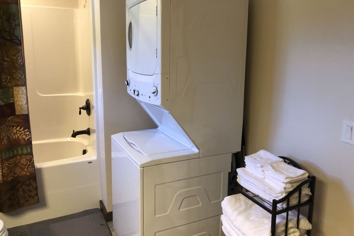 Washer/dryer, detergent, iron, and small ironing board for your use. 