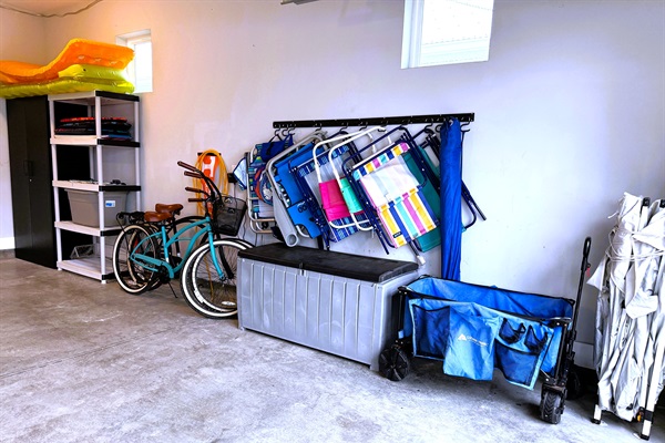 Beach equipment including bikes, chairs, umbrella, snorkelling gear and boogie boards