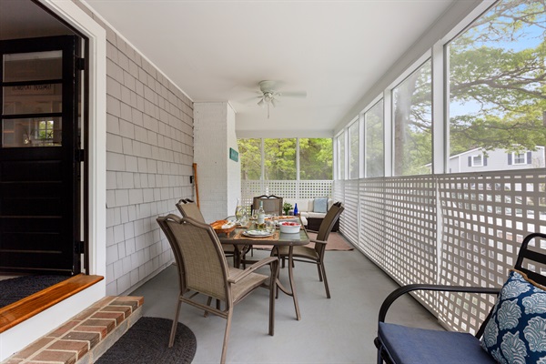 Enjoy meals under the sky on our charming patio with plenty of seating and a sturdy table!