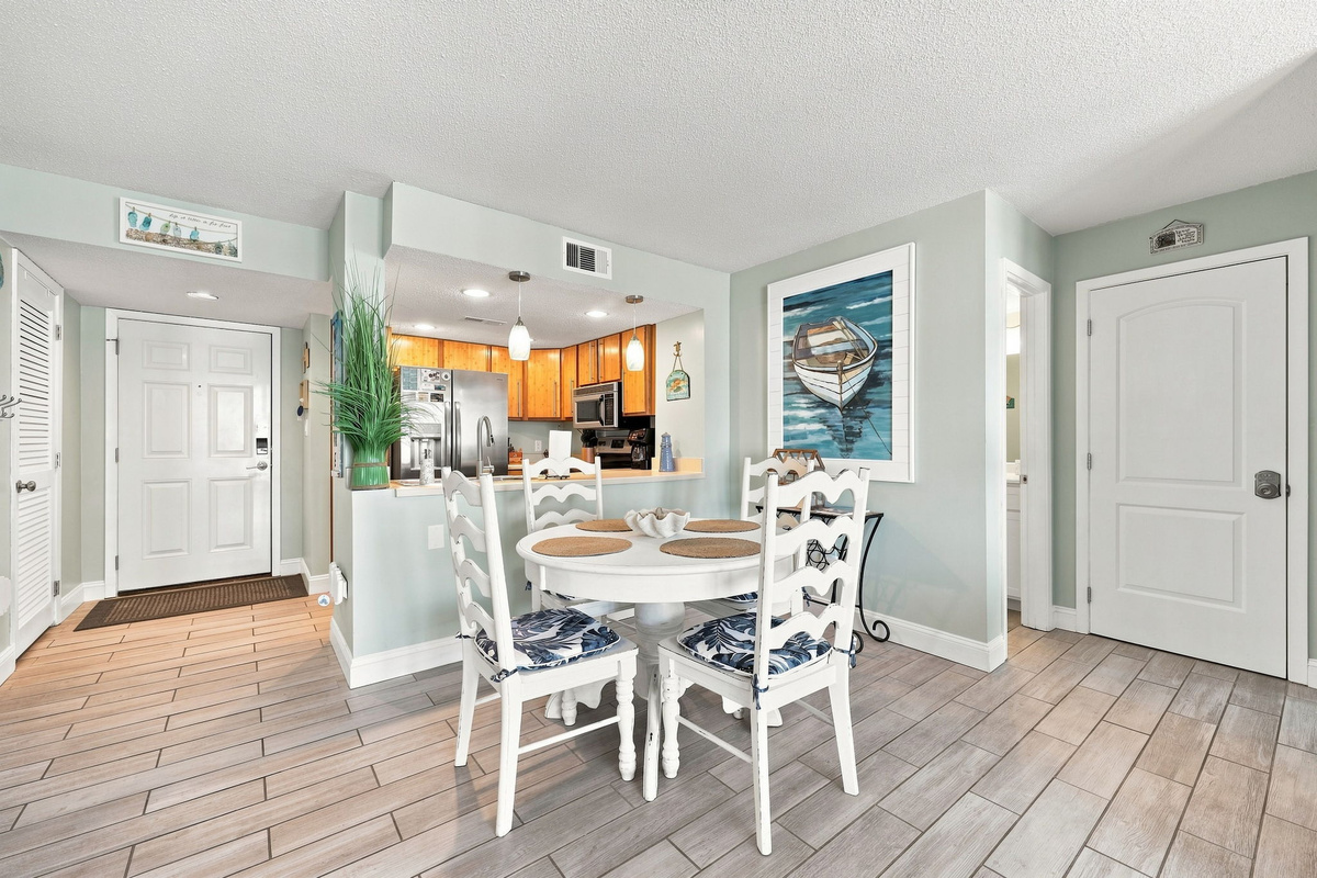Perfect spot for family meals or board games, steps away from the kitchen prep counter.