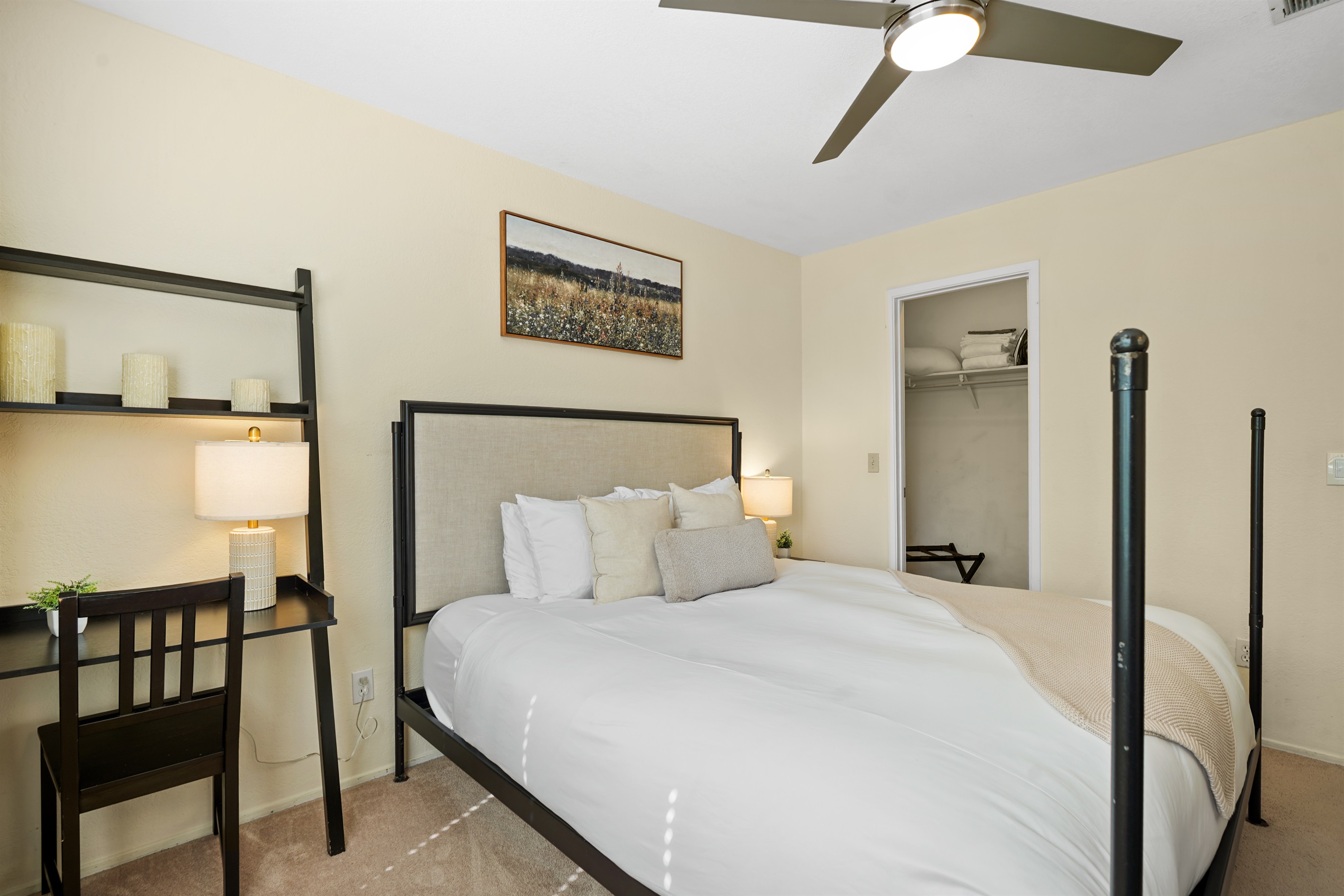 Relax and recharge in this cozy guest bedroom featuring a comfortable queen bed and calming, modern touches.