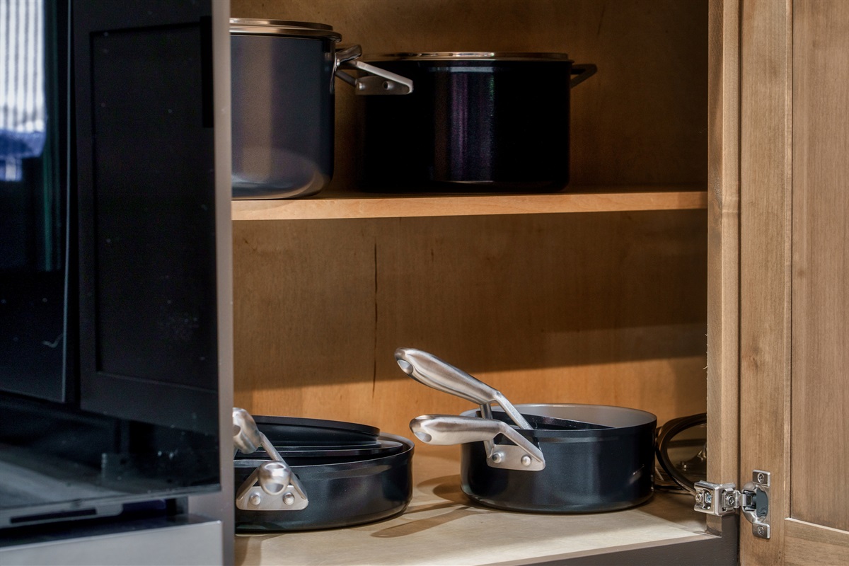 Fully stocked kitchen with pots, pans, rice cooker, blender, toaster, drip, and Keurig and drip coffee machine