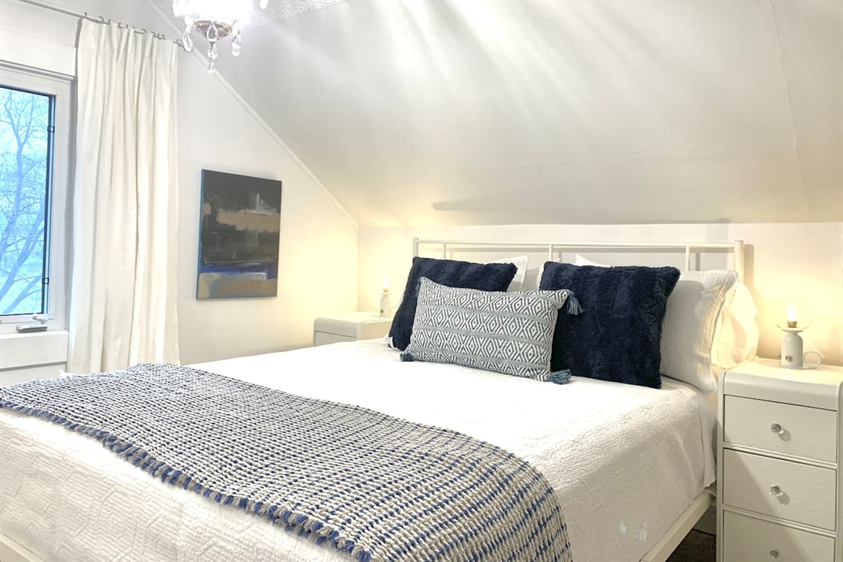 Bright Primary Bedroom with Quality Bedding
Sunny and relaxing primary bedroom. Comfortable mattress and calming décor make this room a guest favorite.