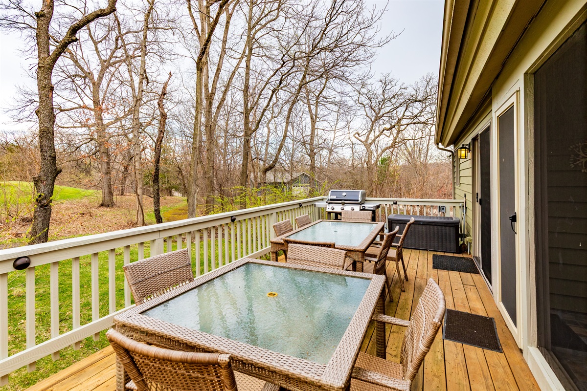 Deck with seating for everyone and Weber gas grill