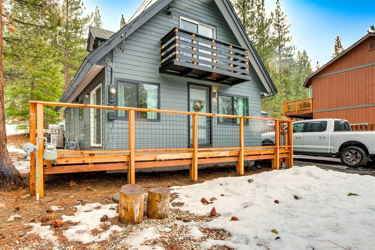 Entrance to the house with a wrap-around deck. 