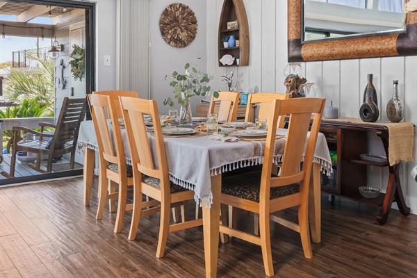 Dine under soaring ceilings and natural light in this thoughtfully styled space, where lake-inspired decor meets cozy charm. When it’s cool outside, slide open the doors to let in the breeze and enjoy a meal that flows effortlessly from indoors to out.