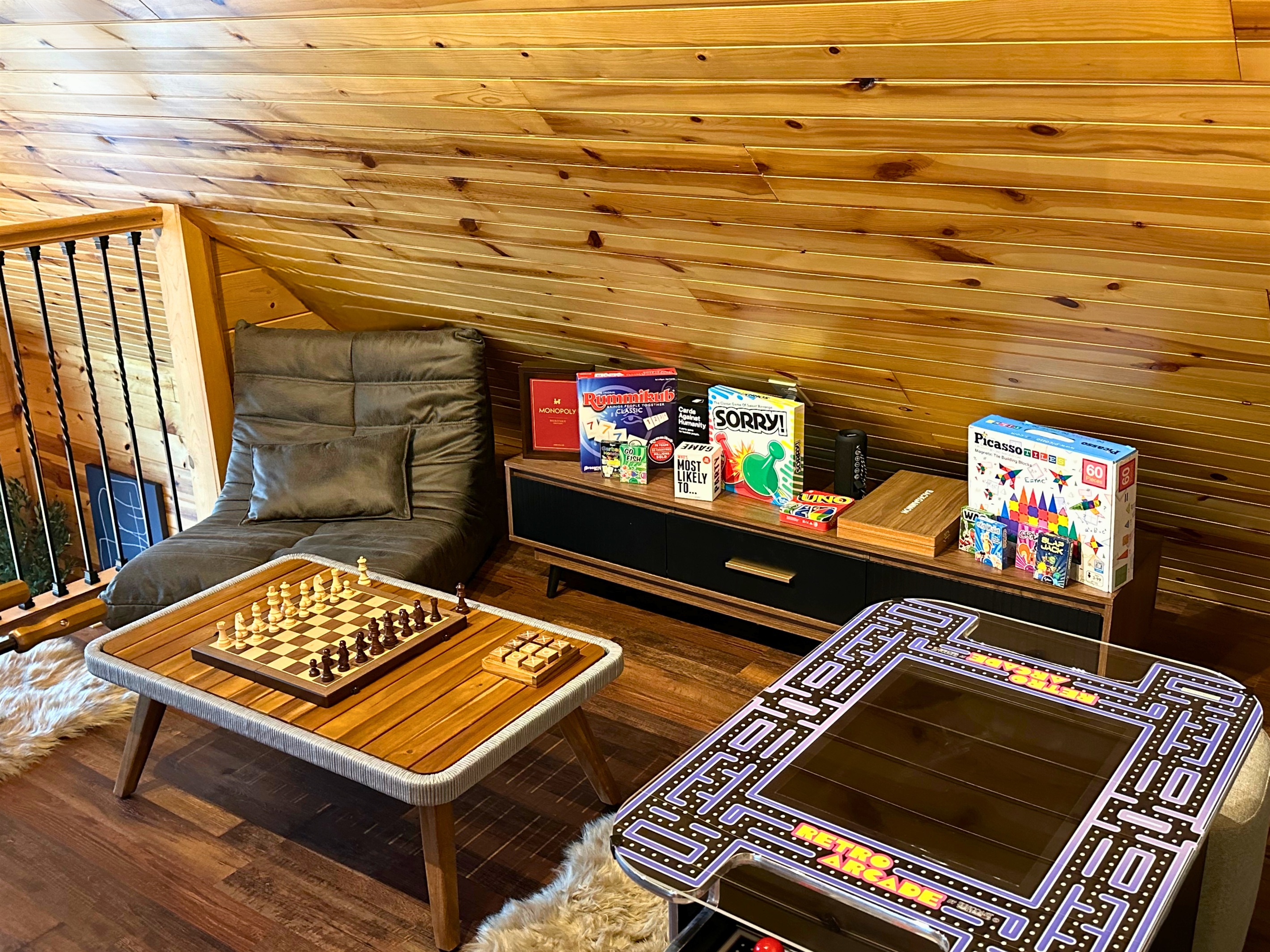 2nd floor: Step into the game room at Signature Stay, featuring arcade games, and a variety of board and card games for endless family fun