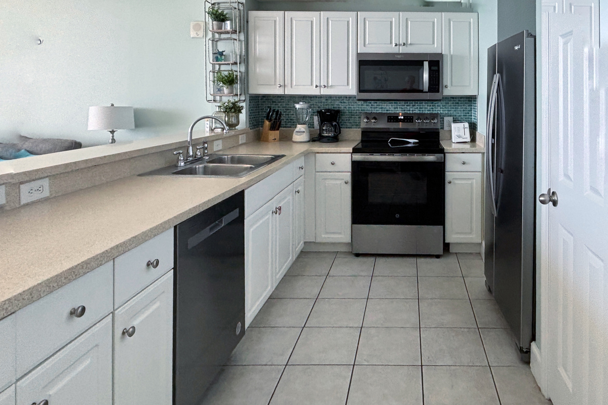 Cook up a seafood dinner on these Corian countertops with lots of kitchen supplies