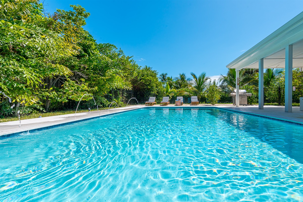Heated saltwater pool with deck jets and color-changing LED lights. Perfect spot to soak up the sunshine and take a dip any time of day.