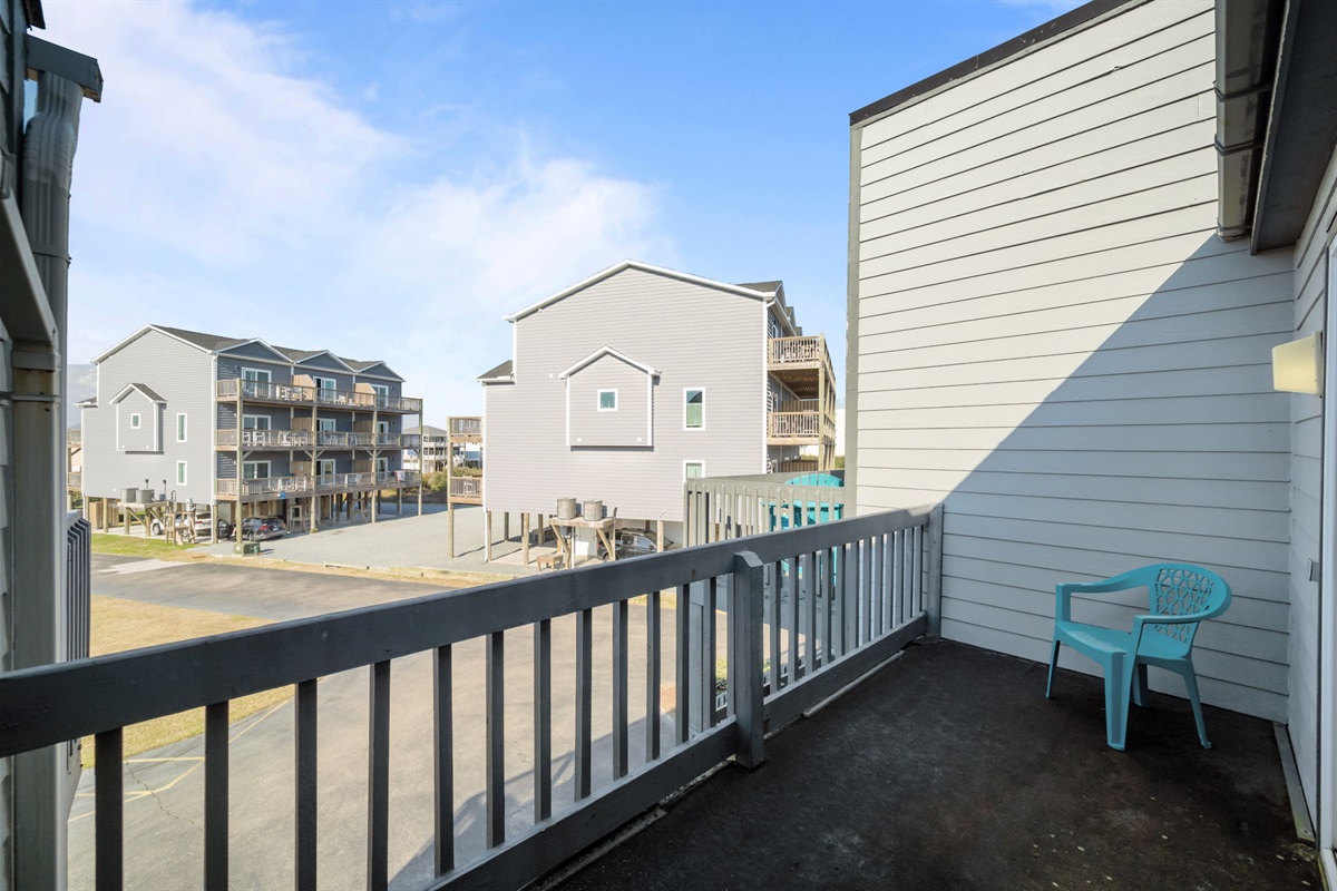 Private balcony space with seating where you can step outside and enjoy the coastal air