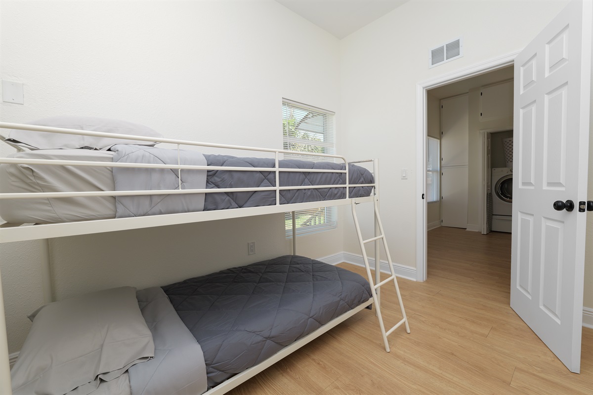 Maximize sleep space without sacrificing style—this clean, minimalistic bunk room is great for families or group stays.