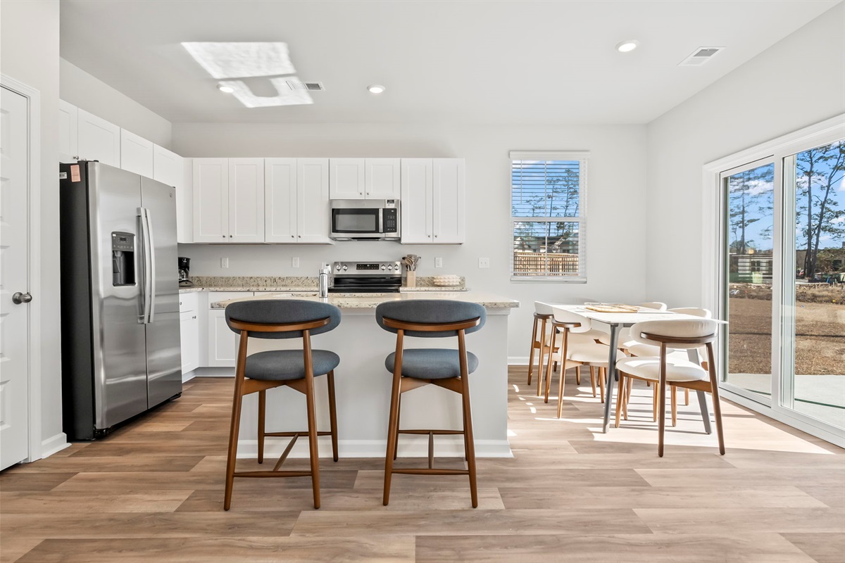 Kitchen with dining table that seats 6
