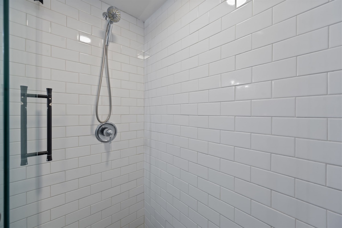 Luxury walk-in shower with sleek tile and glass enclosure
