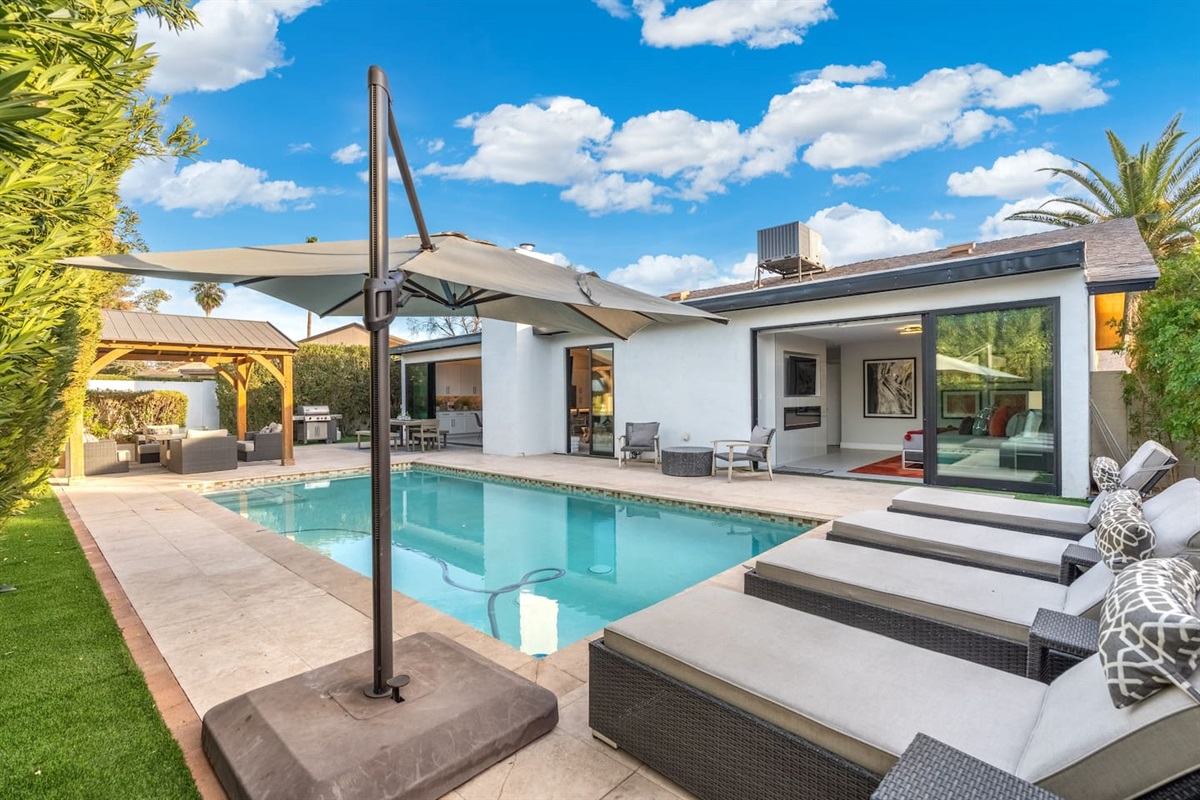 Soak up the sun by the sparkling pool, surrounded by high-end loungers and umbrellas for ultimate relaxation.