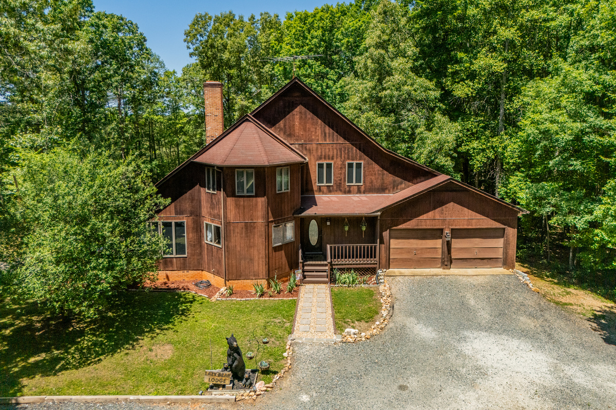 Exterior Retreat: Nestled among lush trees, this charming lodge invites adventure and relaxation!