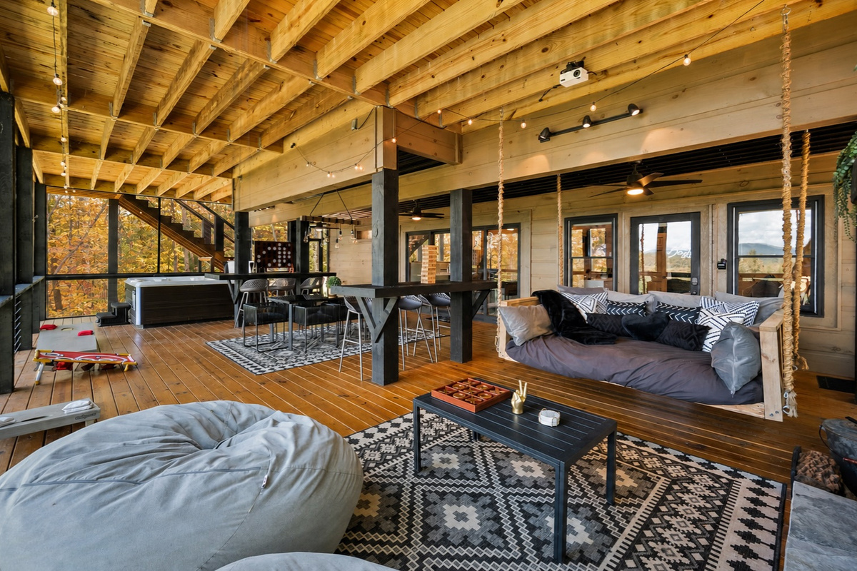 Relax around the swing bed and fireplace, immersed in forest tranquility.