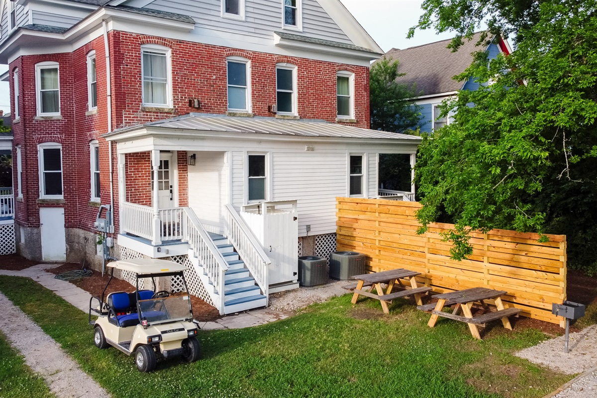 Shared backyard offers additional parking. A BBQ grill and outdoor seating have been recently installed behind the house on each side as well.