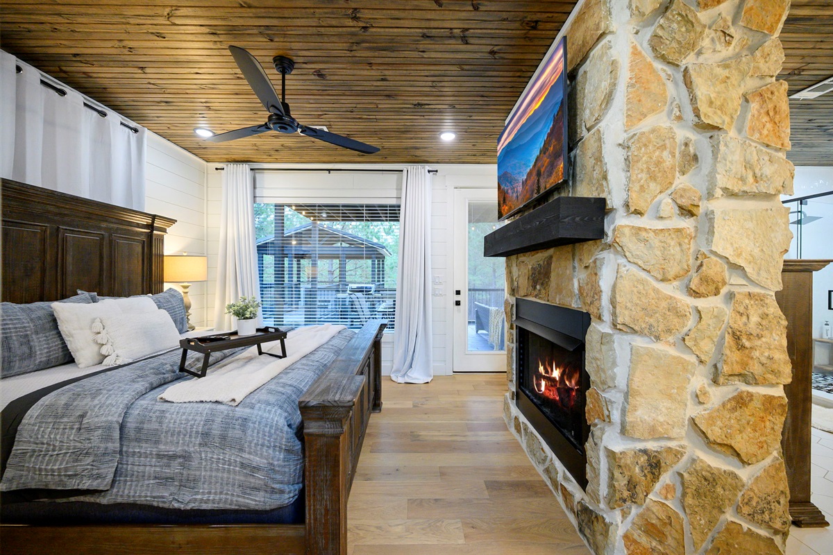 Primary suite featuring a private fireplace and direct deck access &mdash; your own sanctuary. 🔥