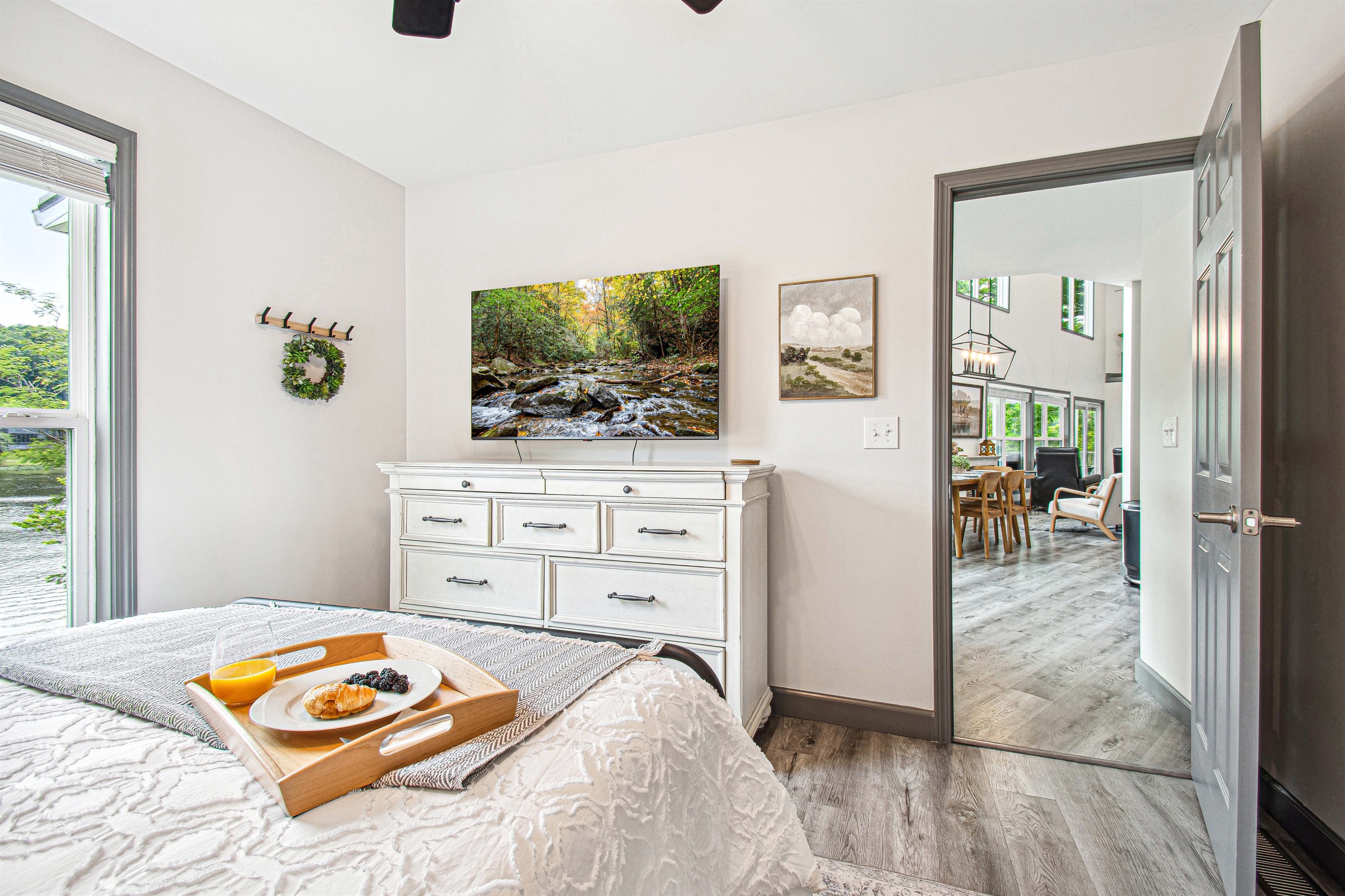 The master suite on the lower level is complete with water views, private bathroom, and 55" Smart TV w/Roku.