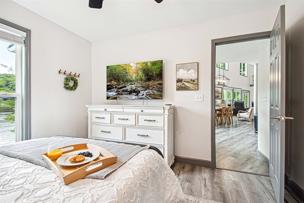 The master suite on the lower level is complete with water views, private bathroom, and 55" Smart TV w/Roku.